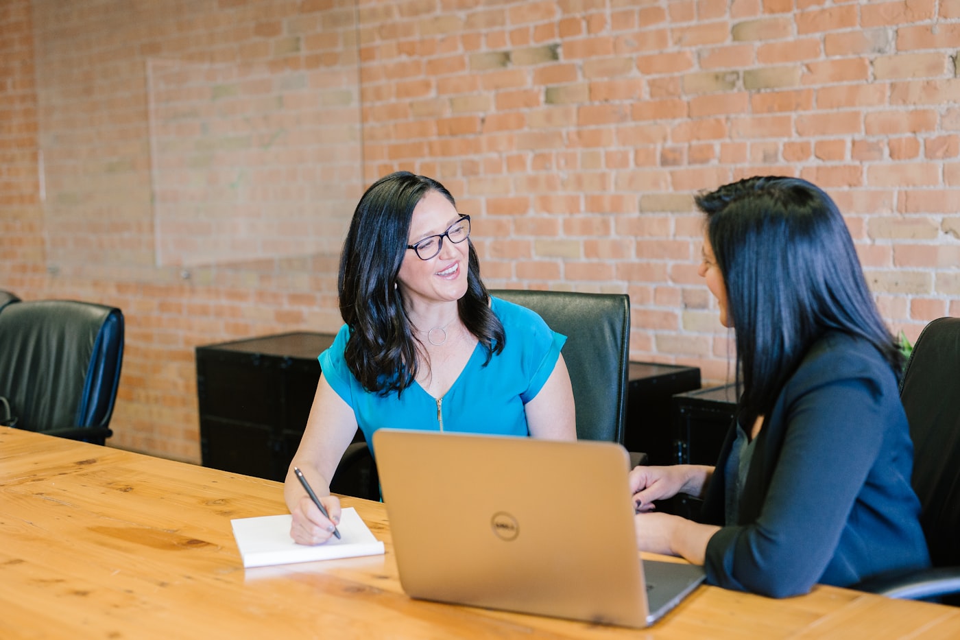 Sales professional working with a laptop in an office